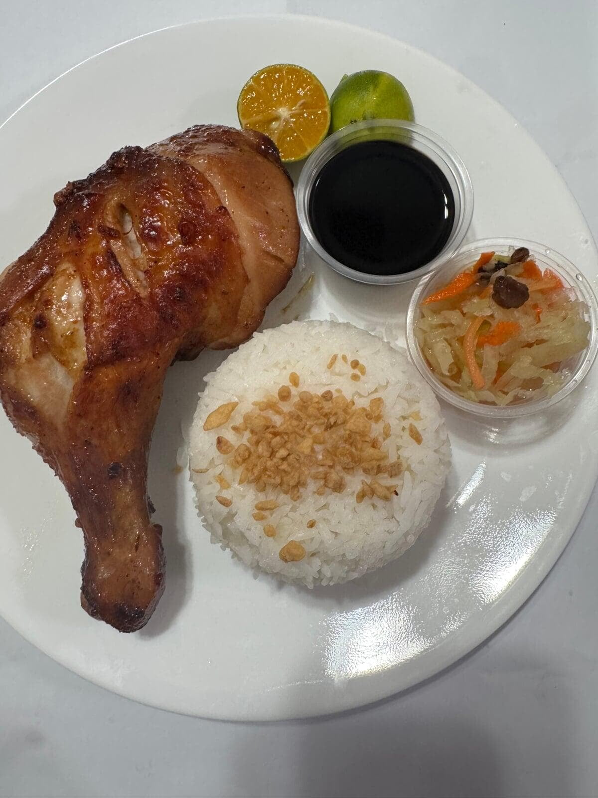 Chicken Inasal with Rice — $16.00 Grilled authentic Filipino marinated chicken quarter served with hot Jasmine rice and atchara.
